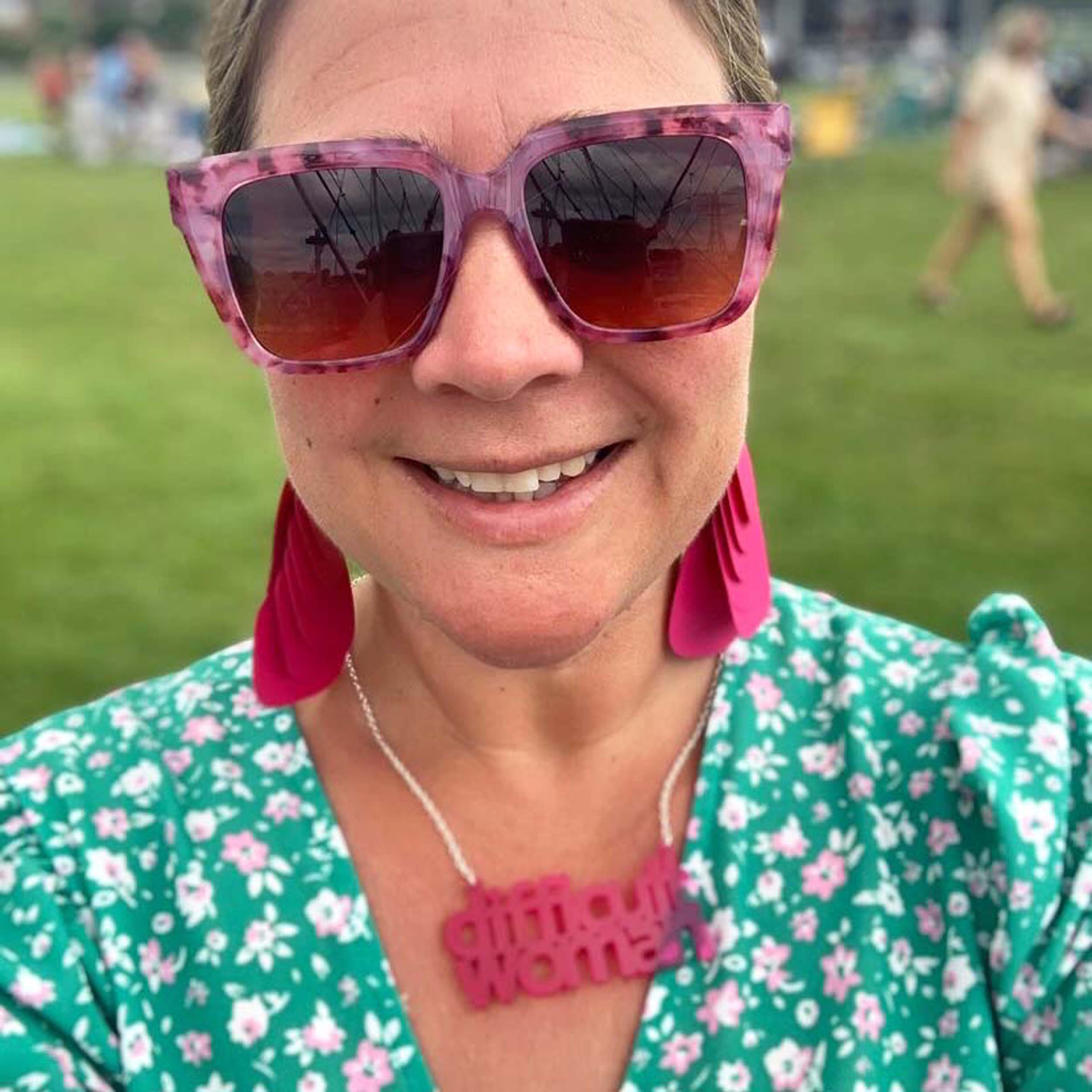 Amy wears a Difficult Woman necklace in neon pink. Designed by Sarah Day for Wear and Resist. 