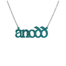 Anodd necklace for Welsh difficult women in bright teal glitter shown hanging on a stainless steel chain. 