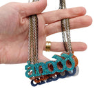A group of Anodd necklaces  with my hand for scale. 
