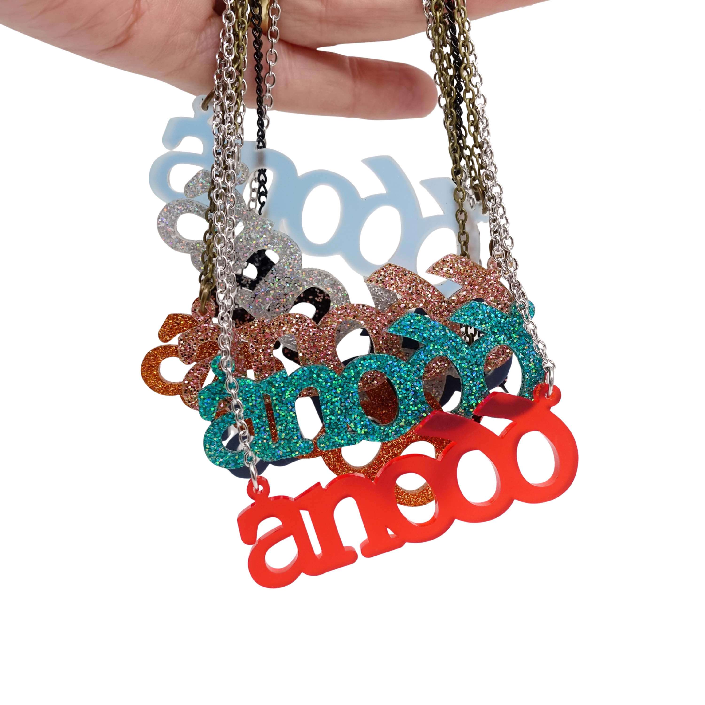 All the colours of Anodd necklaces shown hanging together. 