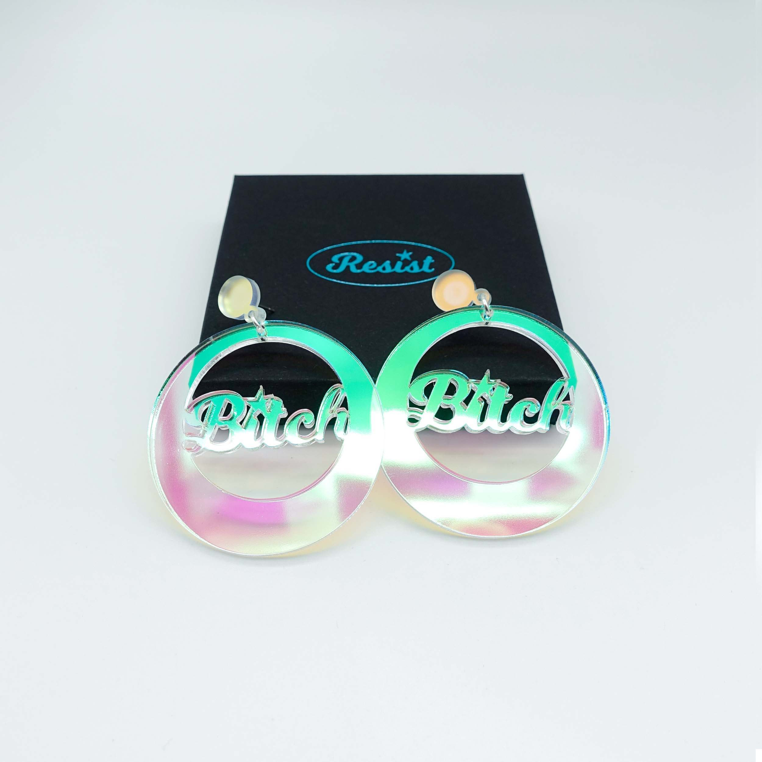 B*tch iridescent earrings. What did you call me? Owning the insult at Wear and Resist. Shown with a gift box. 