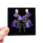 Bluebell earrings shown held up in a Wear and Resist gift box. 