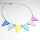 C*nting Bunting necklace in pastel colours shown on a white surface. 