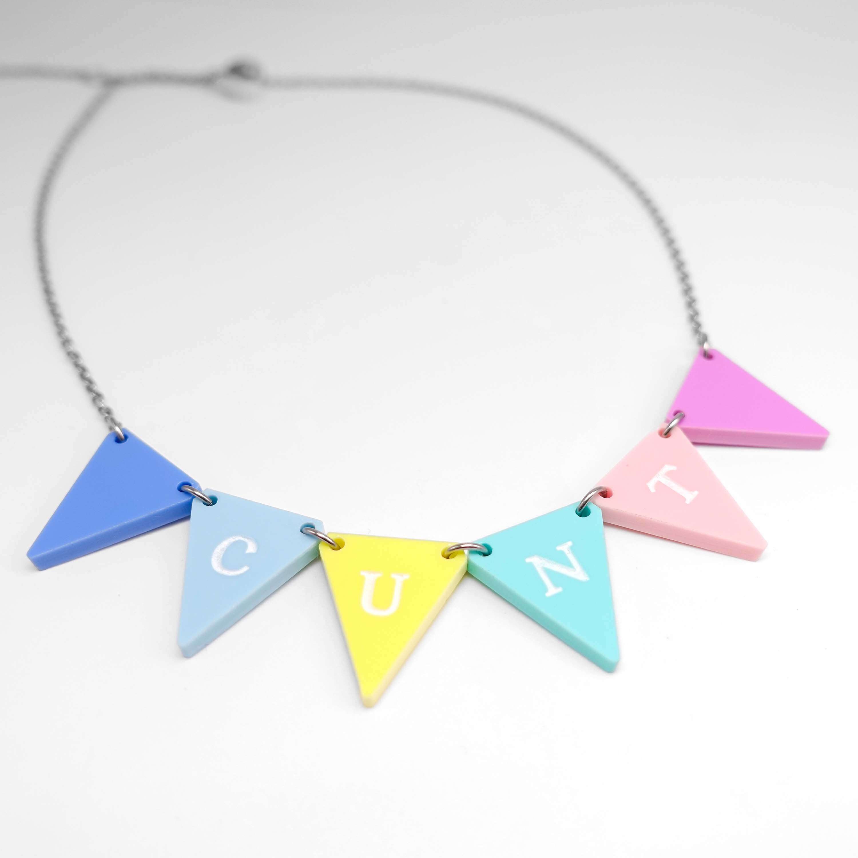 C*nting Bunting necklace in pastel colours shown on a white surface. 