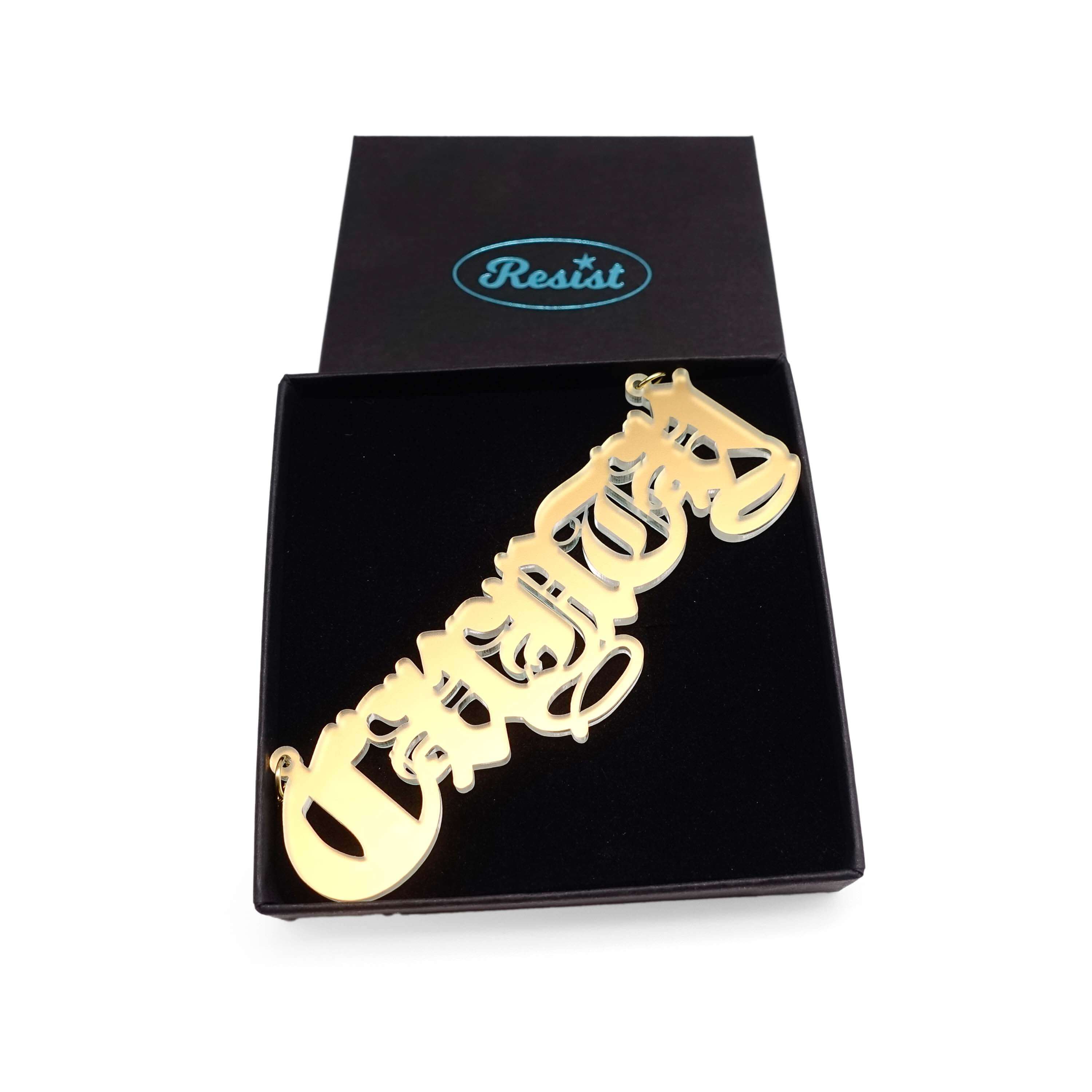 Big C*nty necklace in matte iridescent, shown in a Wear & Resist gift box. 