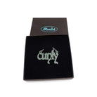 Little CUNTY necklace in matte moss shown in a Wear & Resist gift box. 