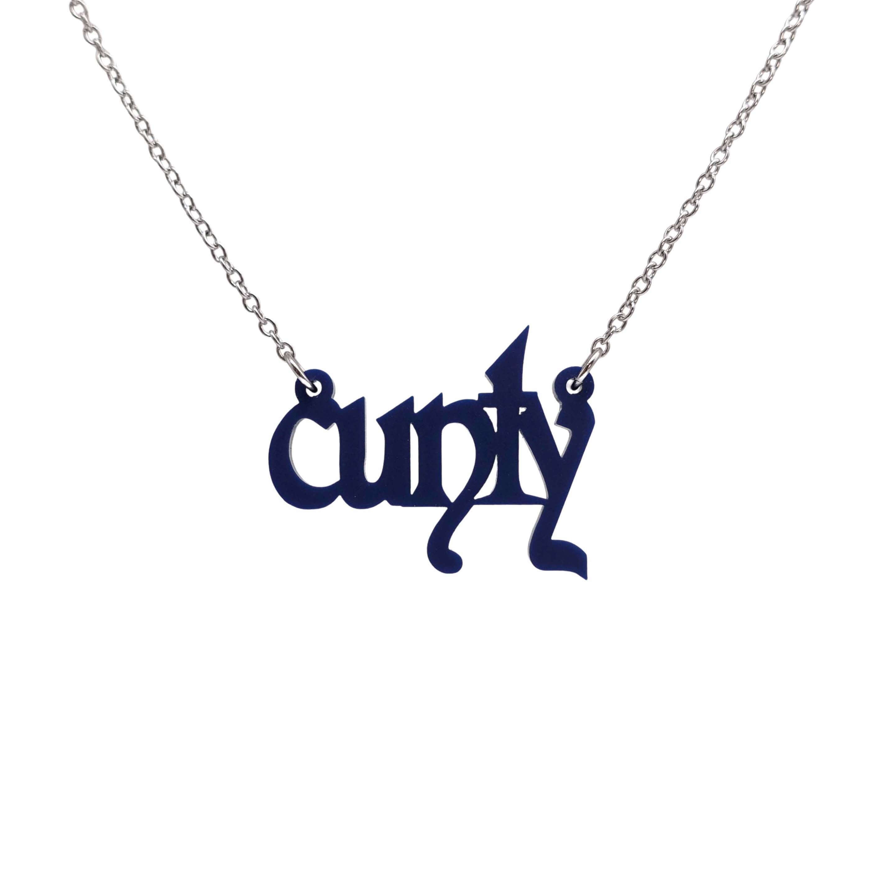Little CUNTY necklace in matte navy shown hanging on a stainless steel chain. 