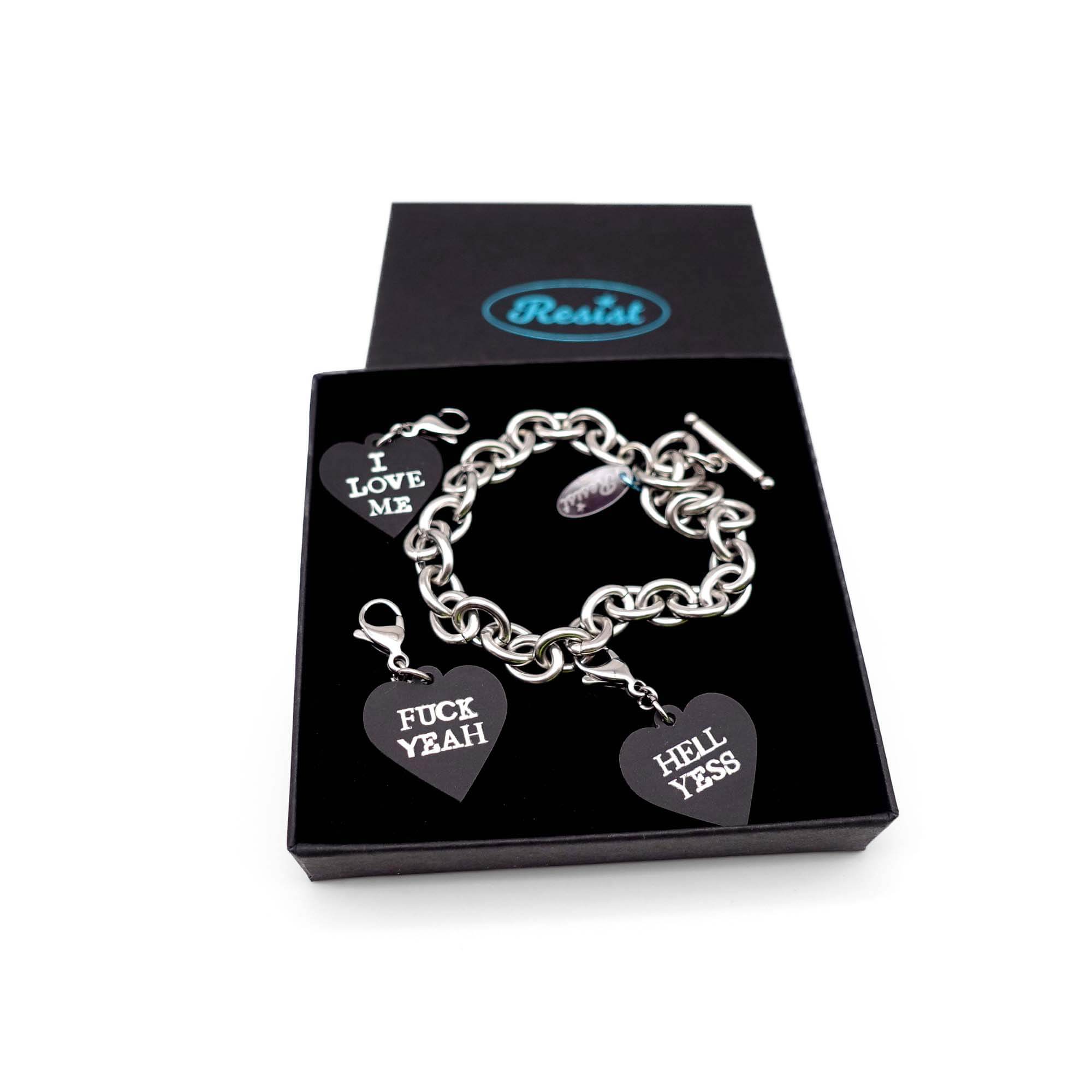 Stainless steel charm bracelet with slate F*ck Yeah, Hell Yes and I Love Me glow-in-the-dark heart charms. 