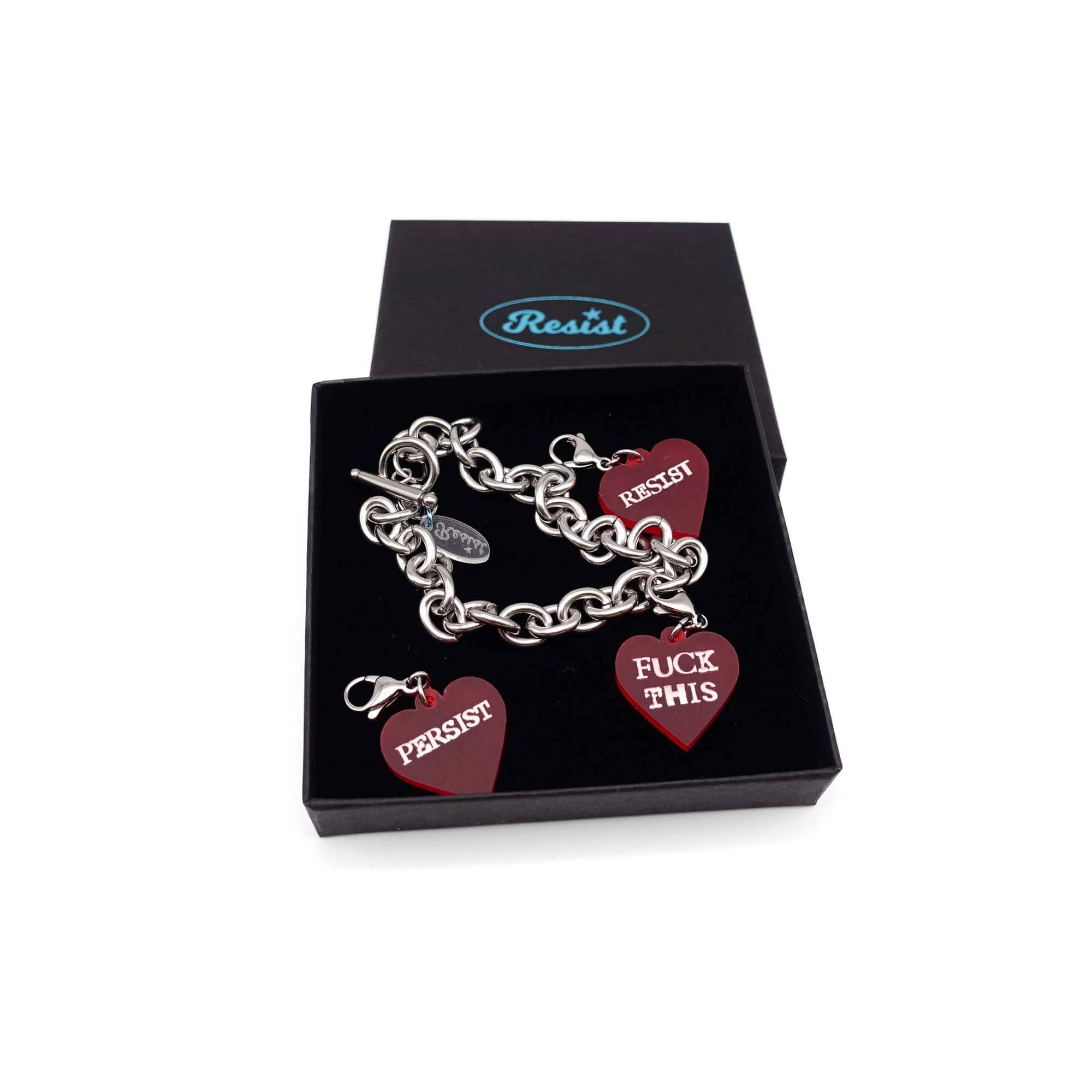 Stainless steel charm bracelet with chilli red Resist, Persist and F*ck This glow-in-the-dark heart charms.