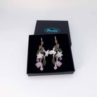 Cherry blossom hoop earrings shown in a Wear and Resist gift box. 