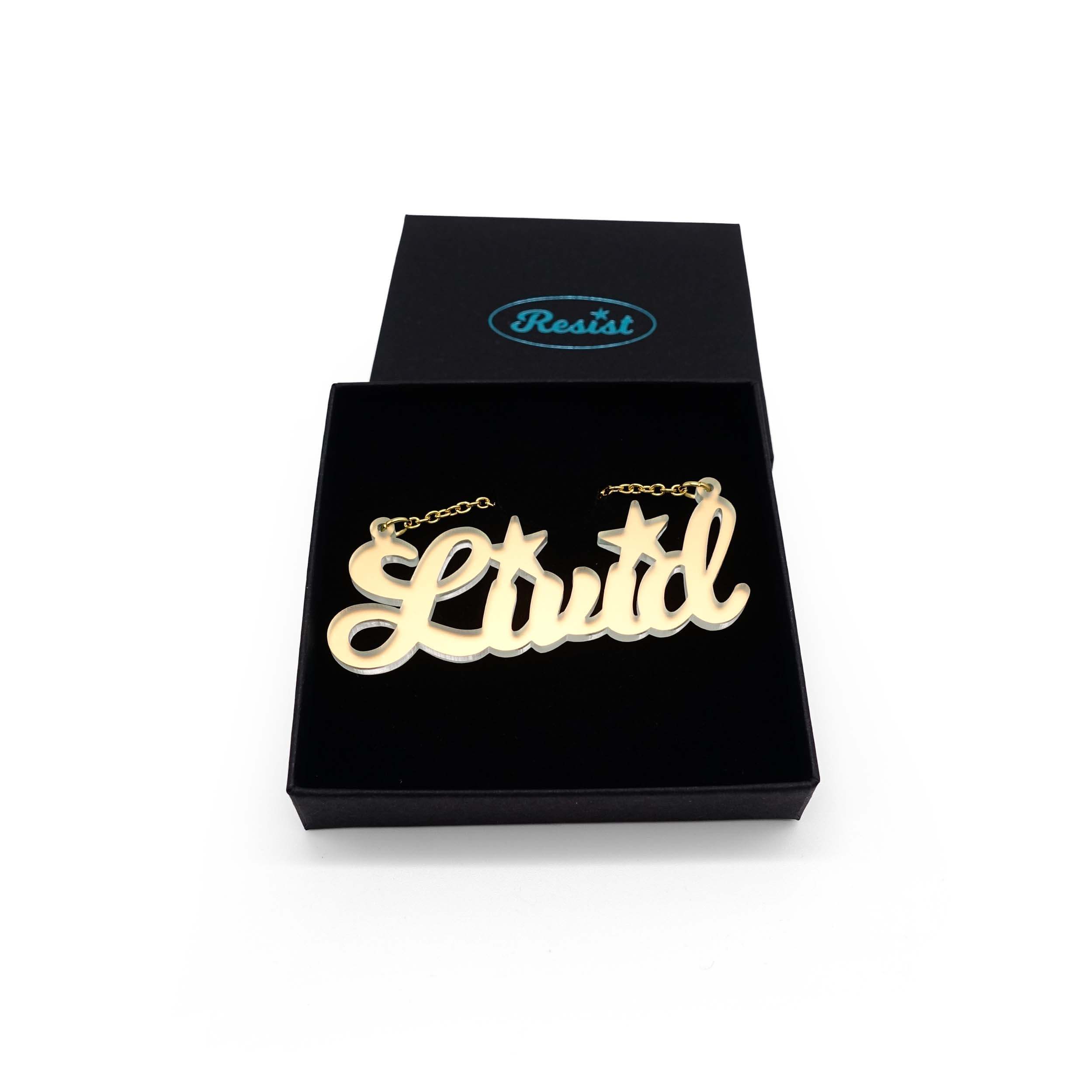 Livid necklace in matte iridescent, shown in a Wear and Resist gift box. 