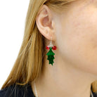 A close up of Eliza wearing the Delicate Holly earrings from the Christmas Collection. 