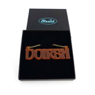 DOIRBH Gaelige necklace for Irish difficult women in cider frost, shown in a Wear & Resist gift box. 