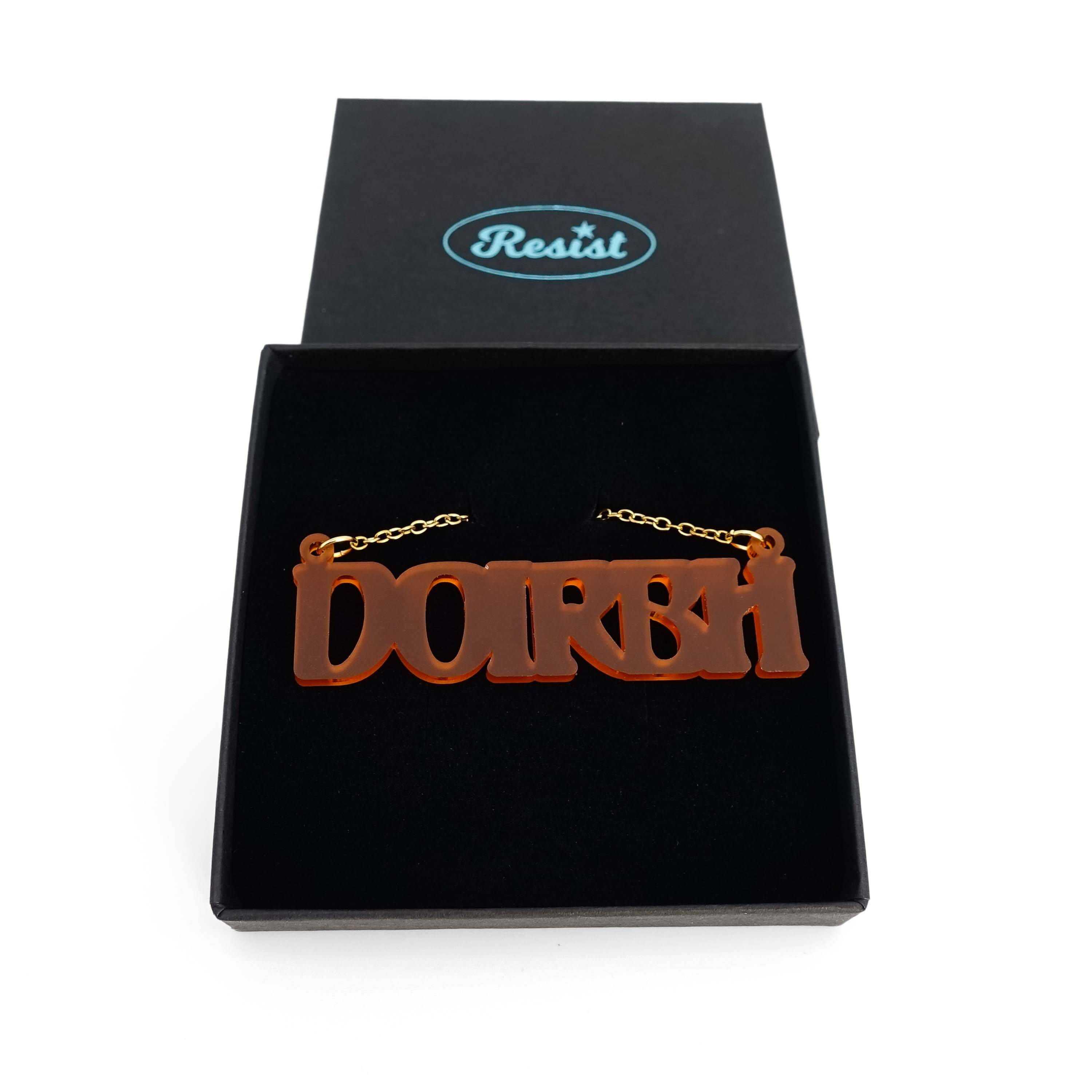 DOIRBH Gaelige necklace for Irish difficult women in cider frost, shown in a Wear & Resist gift box. 
