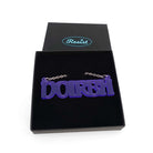 DOIRBH Gaelige necklace for Irish difficult women in violet frost, shown in a Wear & Resist gift box. 