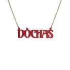 DÒCHAS Irish Gaelige hope necklace in oxblood red shown hanging on an antique gold chain. 