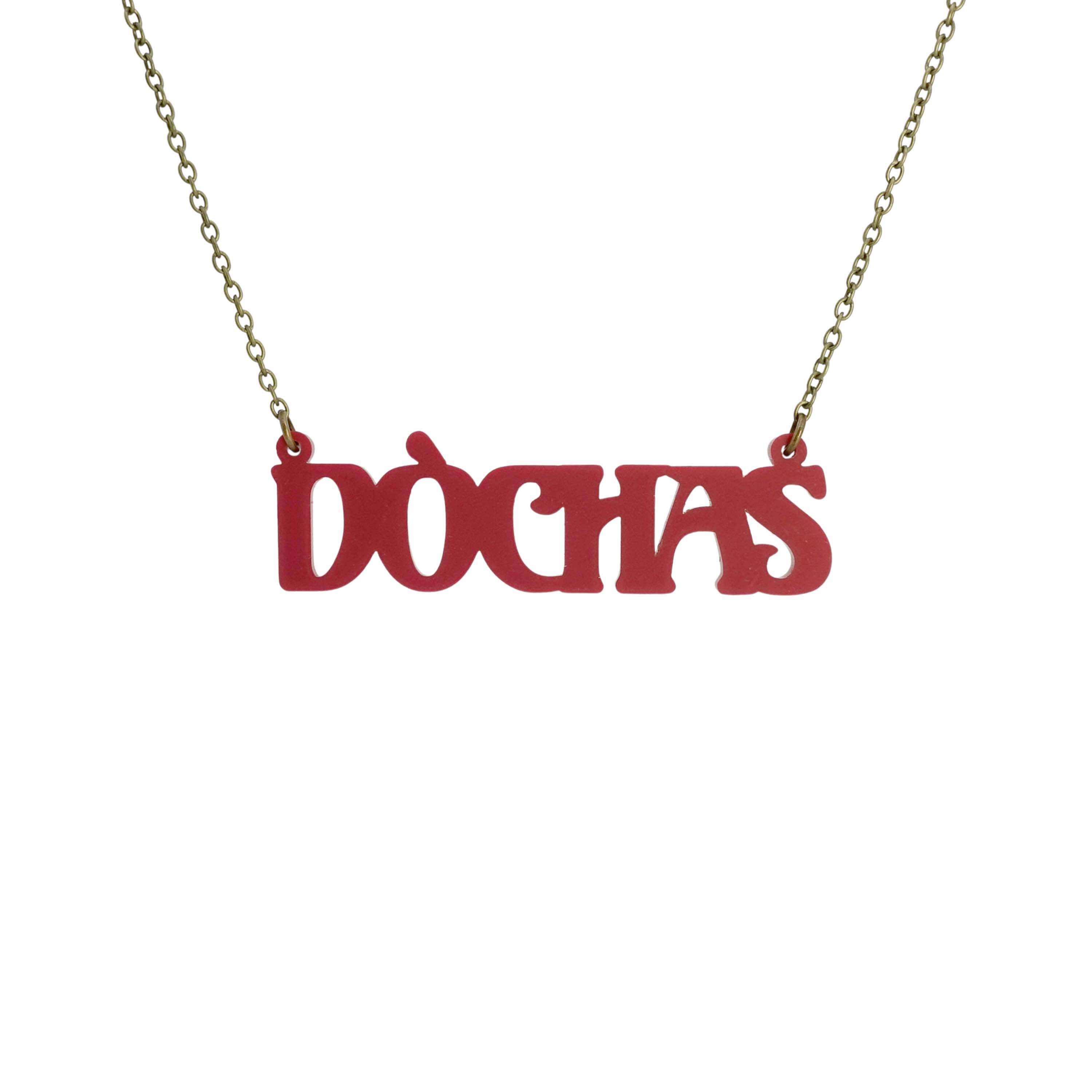 DÒCHAS Irish Gaelige hope necklace in oxblood red shown hanging on an antique gold chain. 