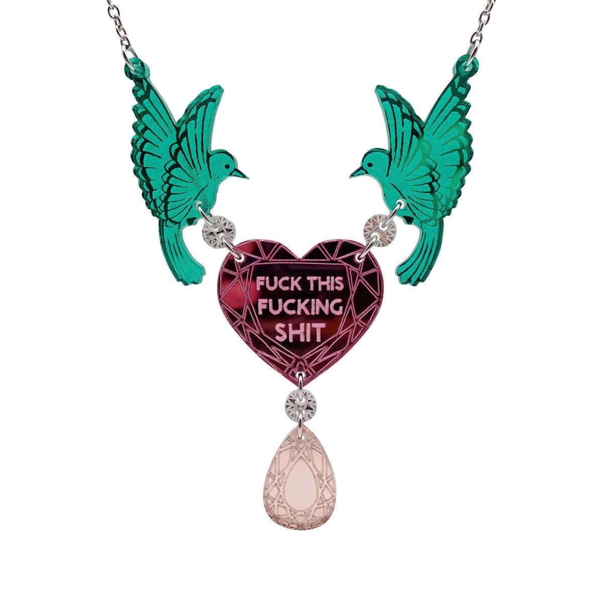 A mirror acrylic necklace with two green birds holding a pink heart that says 'F*ck this F*cking Sh*t' with a rose gold 'jewel' hanging from the centre. 