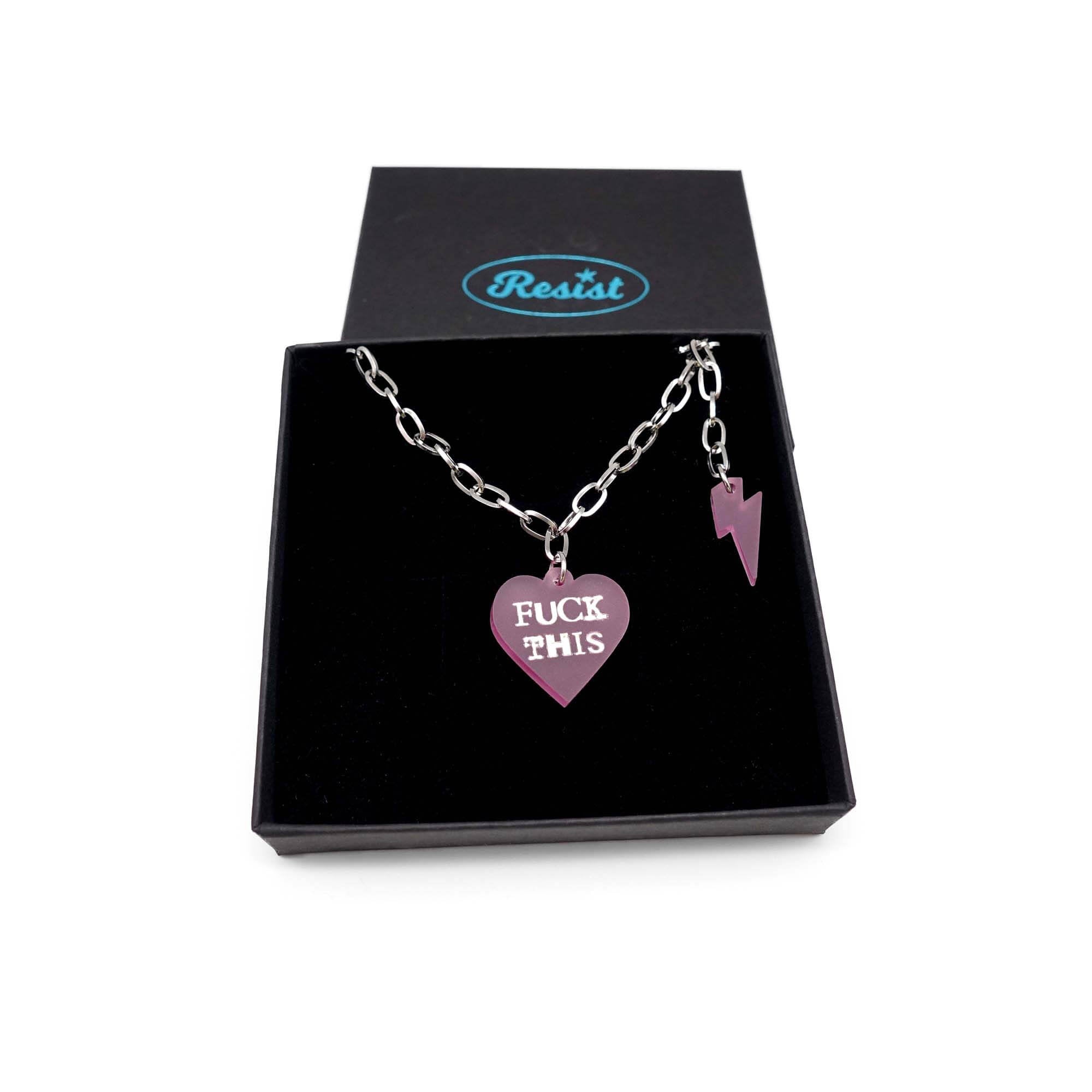 F*ck This punk necklace in pale pink frost with matching lightning bolt  shown in a Wear and Resist gift box. 