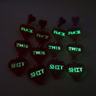 F*ck this Sh*t earrings glowing in the dark. £2 goes to Bloody Good Period. 