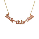 F*ck this Sh*t necklace in pink fizz glitter shown hanging on a gold-plated stainless steel chain against a white background.