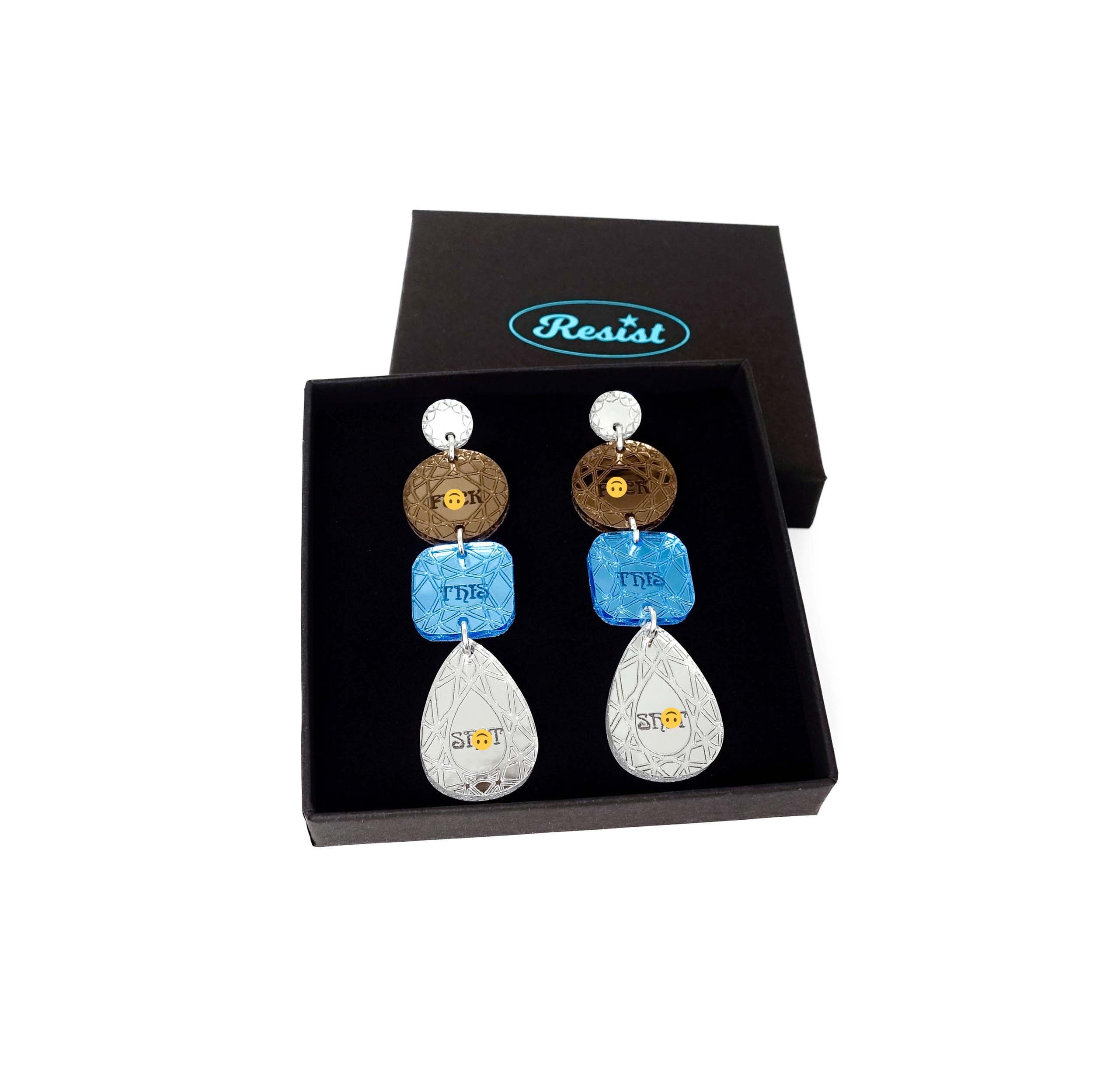 Sweary austerity jewel earrings in blue bronze and silver shown in a Wear and Resist gift box. 