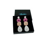 F*ck This Shit Sweary Jewel Drop Earrings in pink and rose gold shown in a Wear and Resist gift box. 