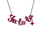 Fa La LA necklace in hot pink glitter,  with hanging vintage star, shown hanging against a white background.