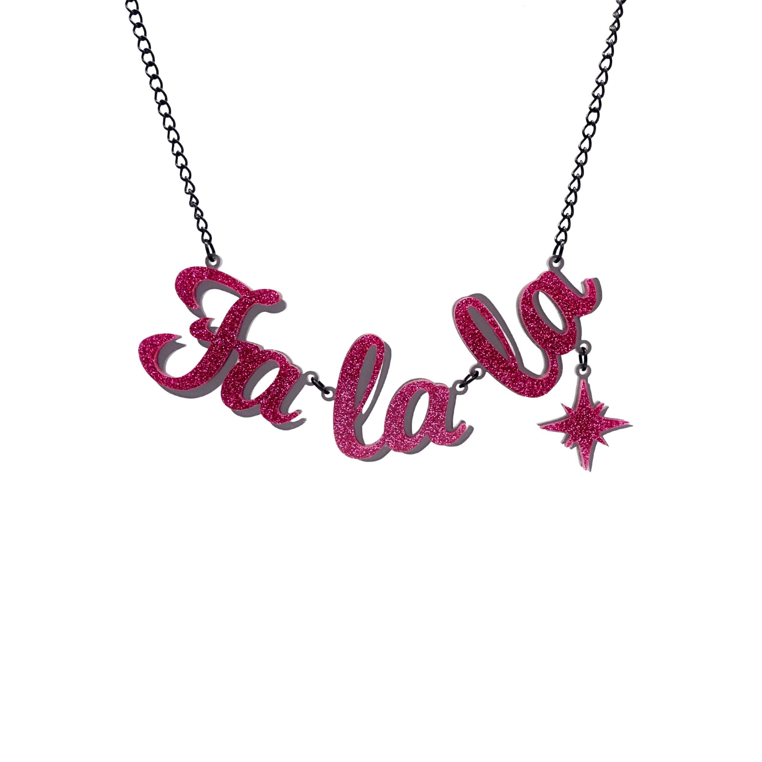 Fa La LA necklace in hot pink glitter,  with hanging vintage star, shown hanging against a white background.