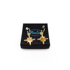 Gold mirror limited edition Festive Vintage Star earrings, shown on a Wear and Resist gift box.  