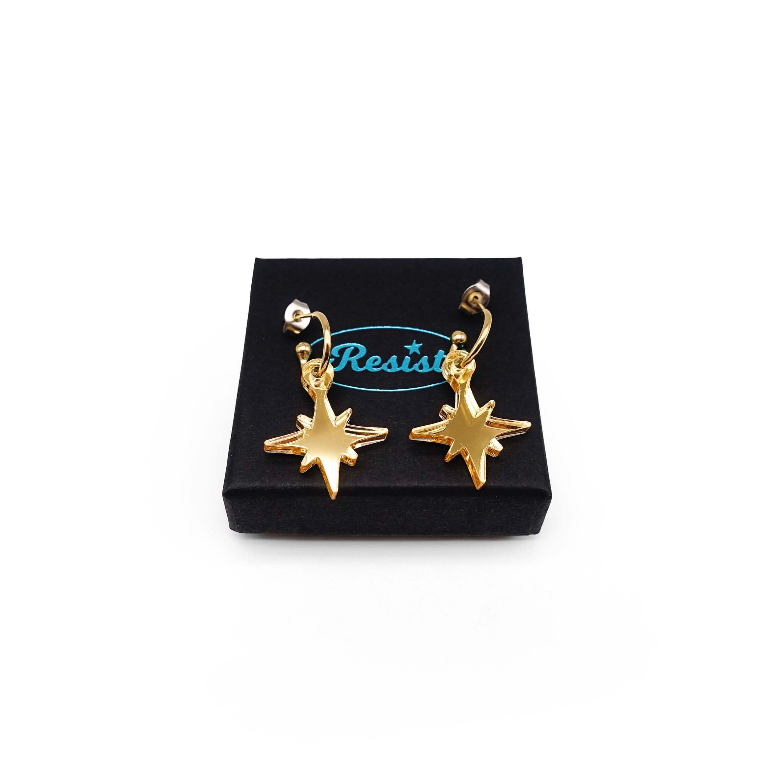 Gold mirror limited edition Festive Vintage Star earrings, shown on a Wear and Resist gift box.  