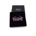 Hope necklace with Rebel Alliance symbol in pale pink frost, shown in a Wear and Resist gift box. 