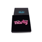 Nasty necklace in pink glitter, shown in a Wear and Resist gift box. 