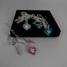 I love me glow in the dark choker and bracelet in all three colours shown glowing in the dark on a Wear and Resist gift box. 