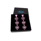 I Love Me heart drop earrings in pale pink frost shown in a Wear and Resist gift box. 