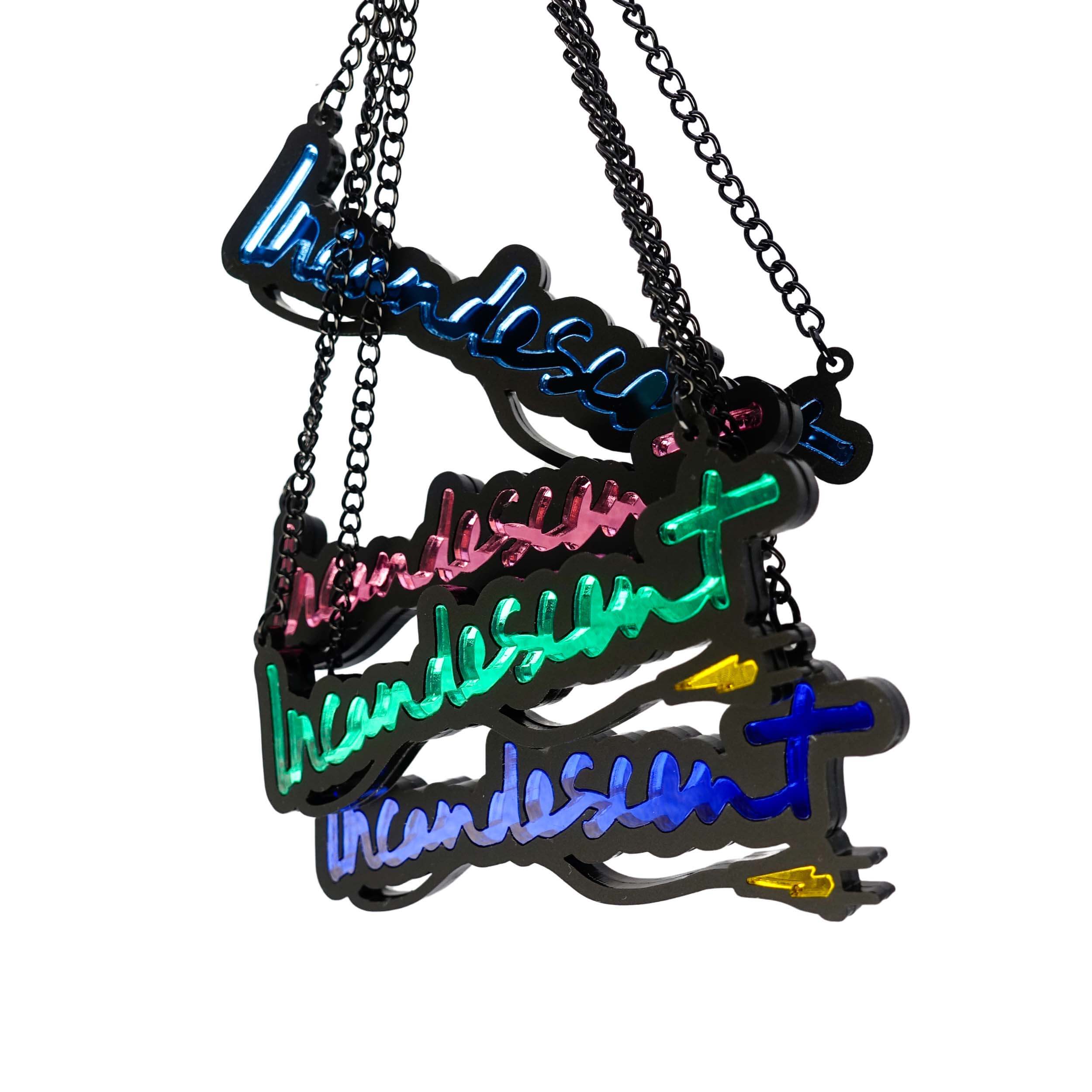 All four colours of Incandescent neon necklaces shown hanging together. 