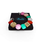 Jewel bracelet with stainless steel toggle clasp shown open on a Wear and Resist gift box.