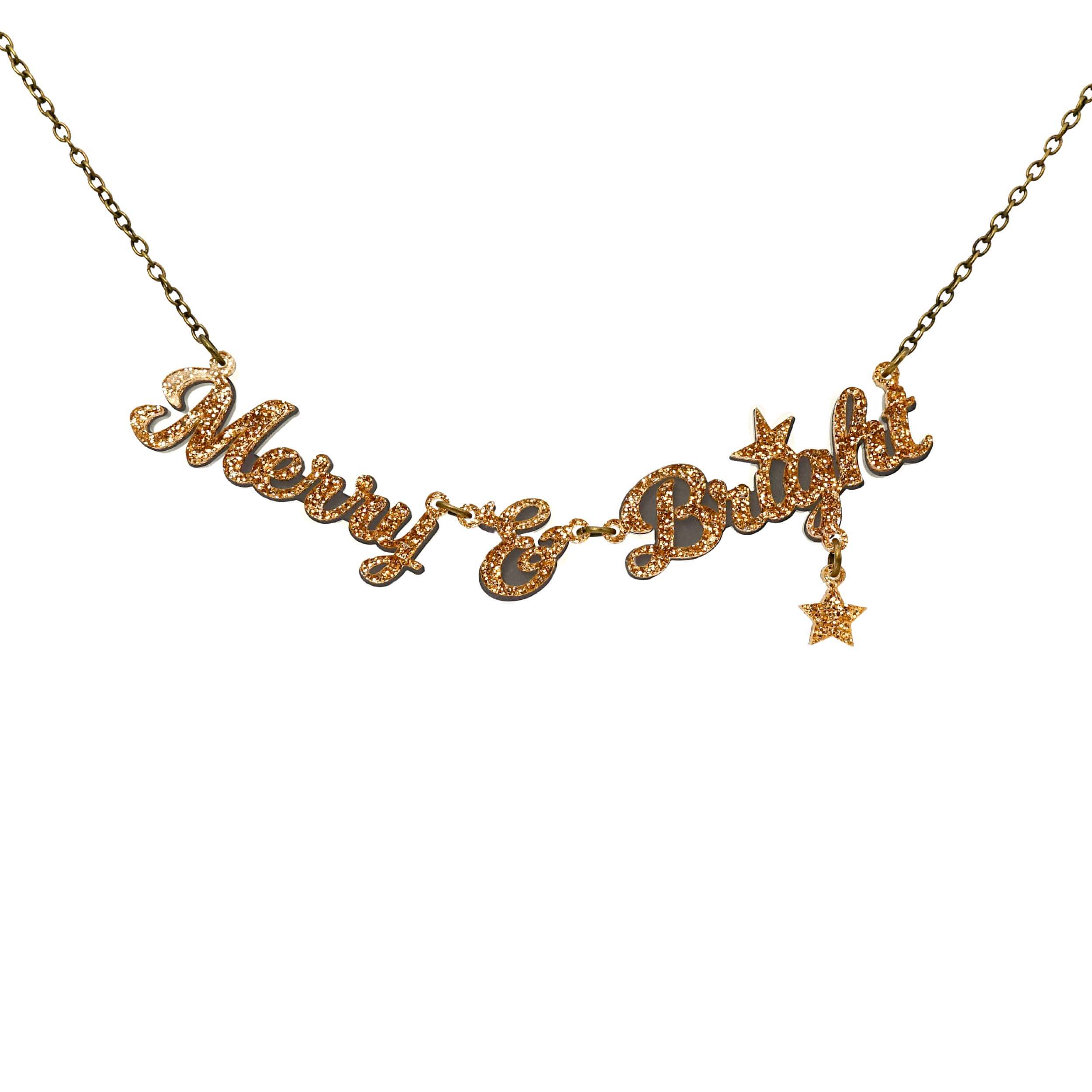 Merry & Bright necklace in gold glitter on an antique gold chain, shown hanging against a white background. 