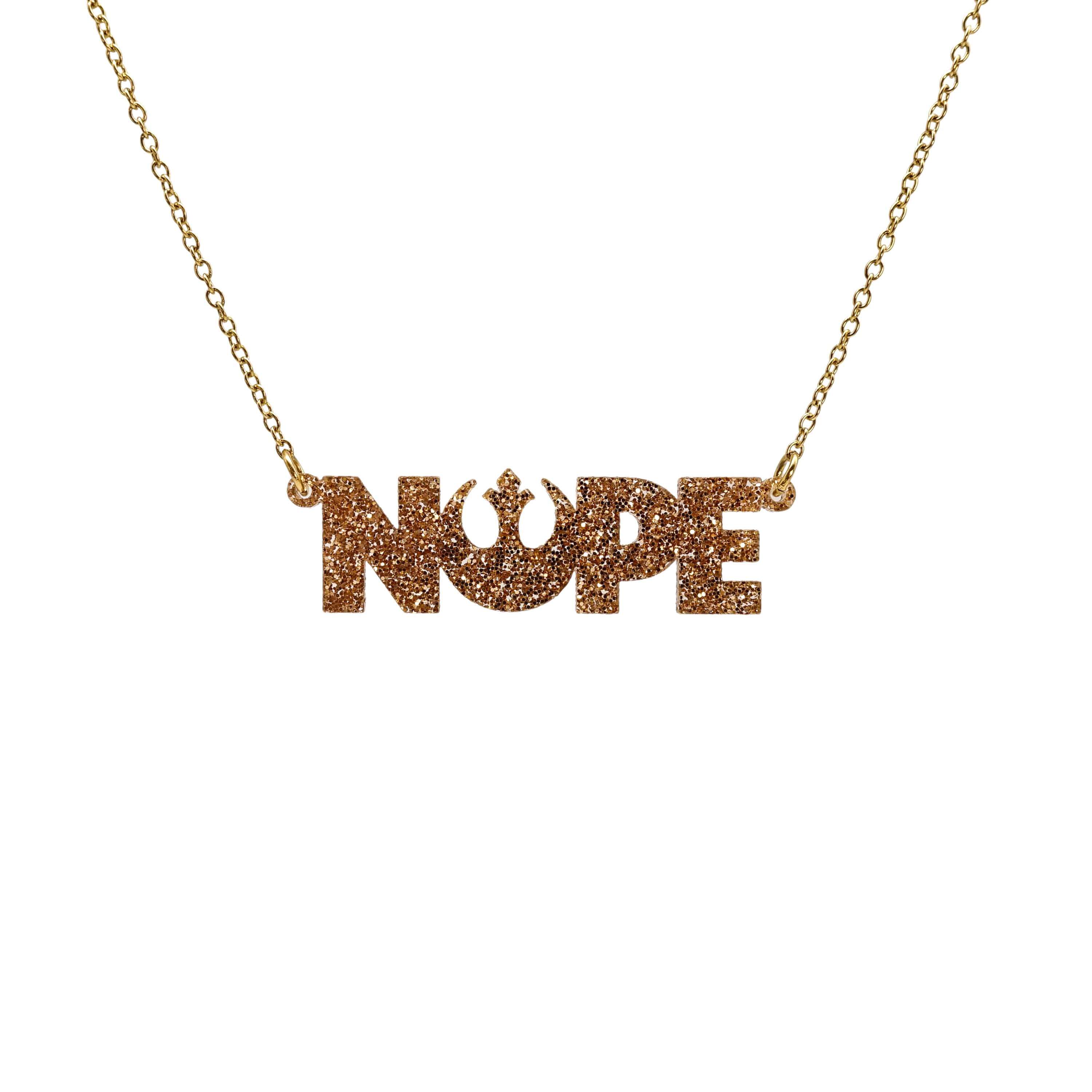 Nope necklace with Rebel Alliance symbol in gold glitter hanging on a gold plated stainless steel chain against a white background. 