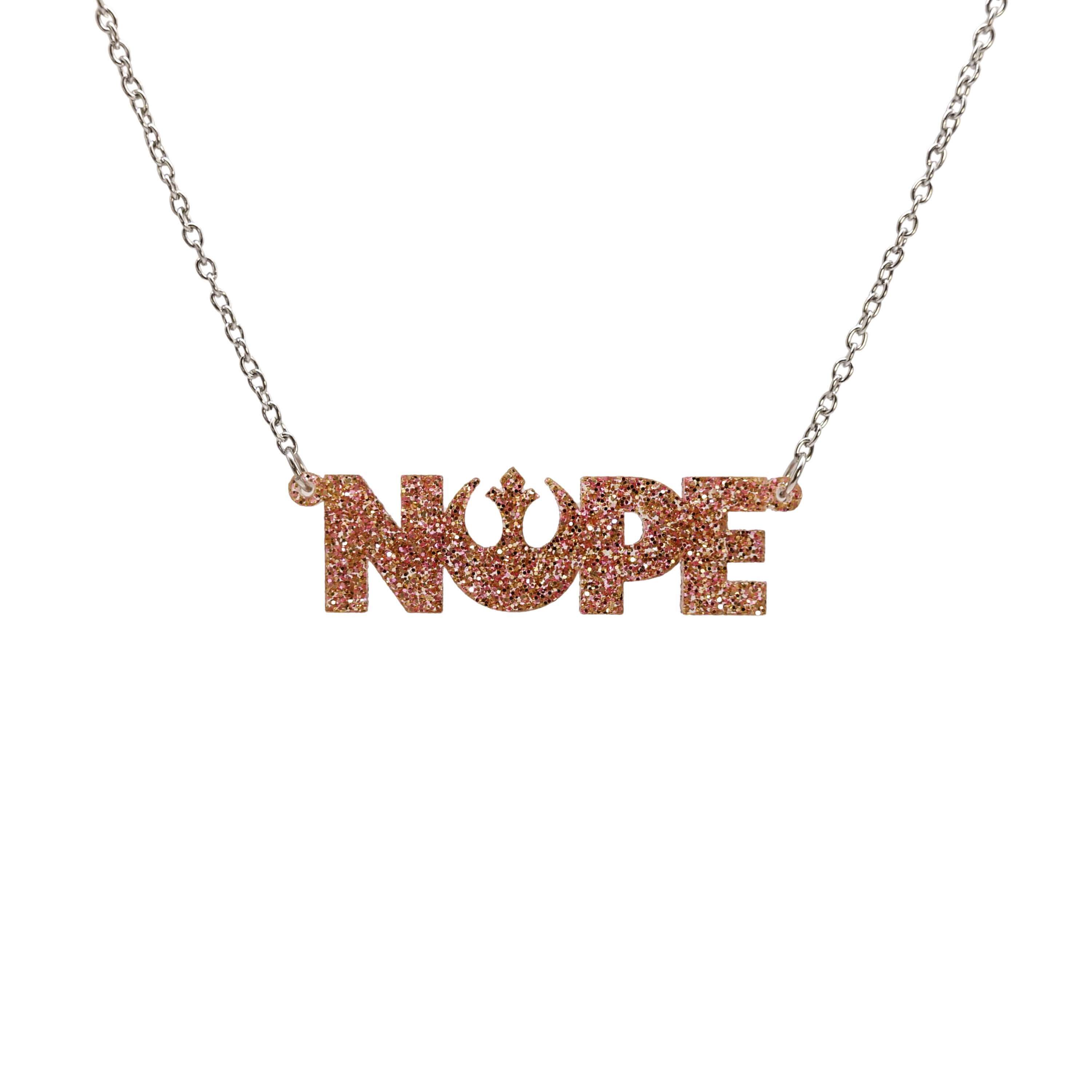 Nope necklace with Rebel Alliance symbol in pink fizz glitter hanging on a stainless steel chain against a white background. 