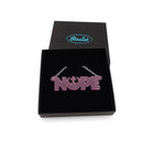 Nope necklace with Rebel Alliance symbol in pale pink frost, shown in a Wear and Resist gift box. 