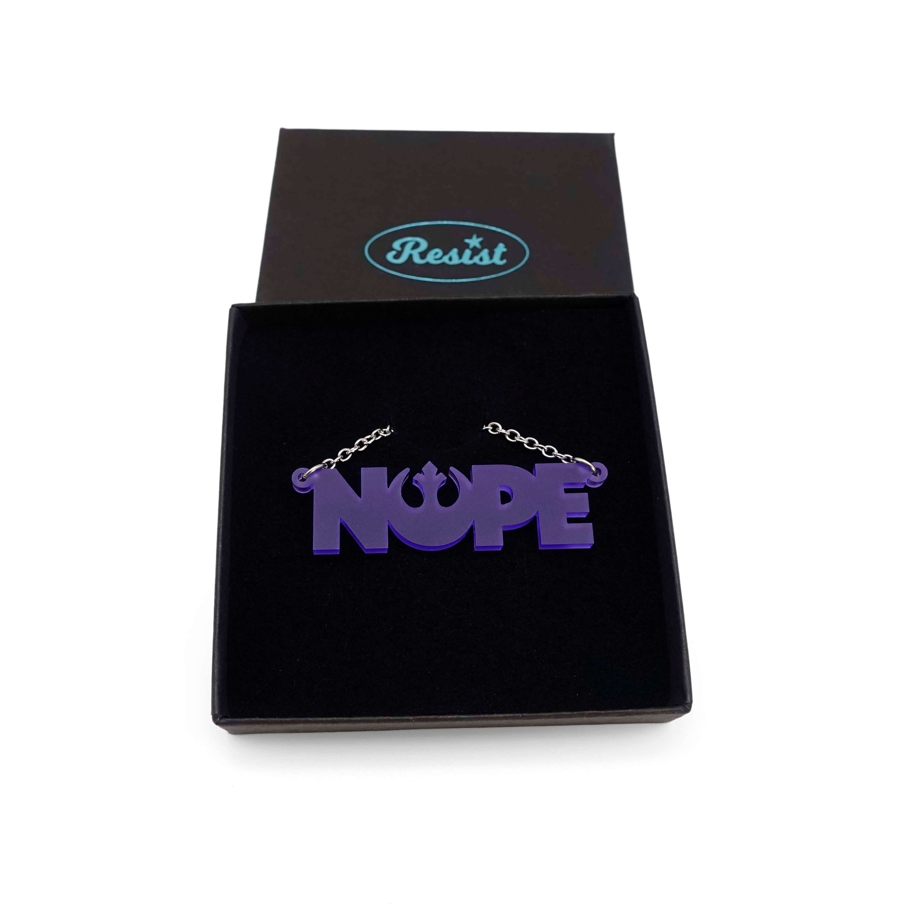 Nope necklace with Rebel Alliance symbol in violet frost, shown in a Wear and Resist gift box. 