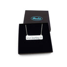 Not Having It necklace in silver mirror on a stainless steel chain shown in a Wear and Resist gift box. 