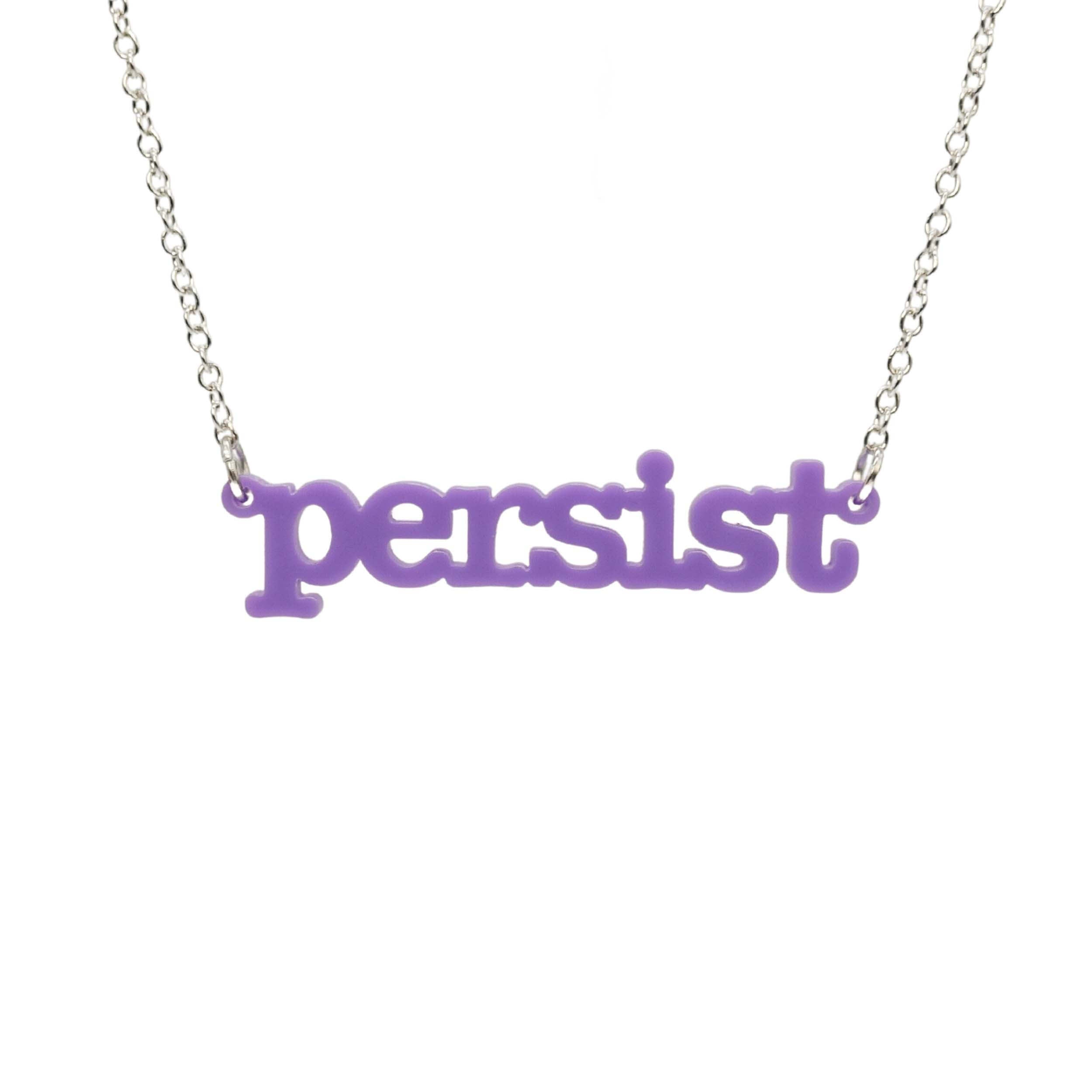 Parma violet Persist necklace in typewriter font hanging on a silver chain against a white background. 