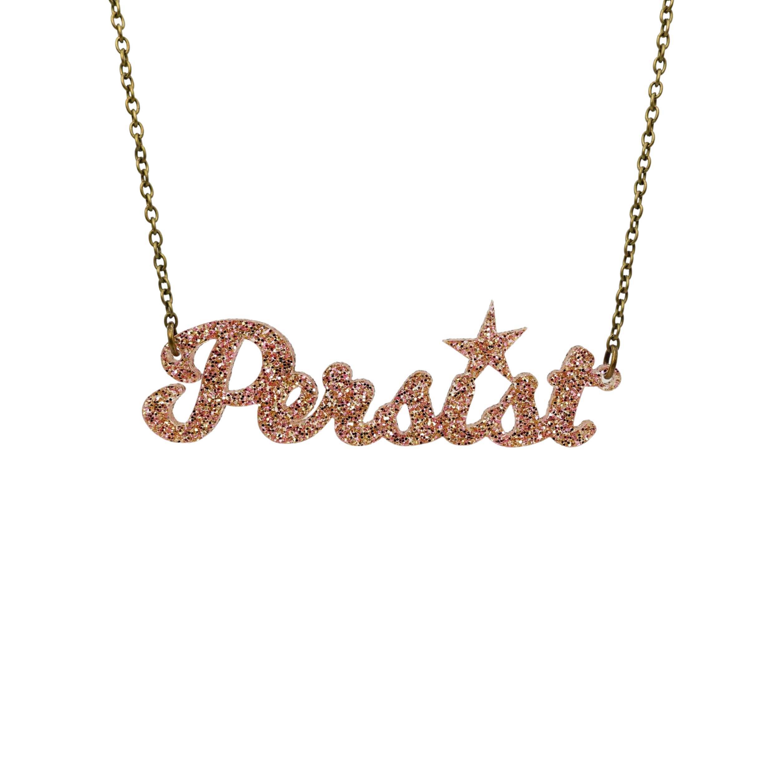 Persist necklace in in pink fizz glitter, shown hanging against a white background.