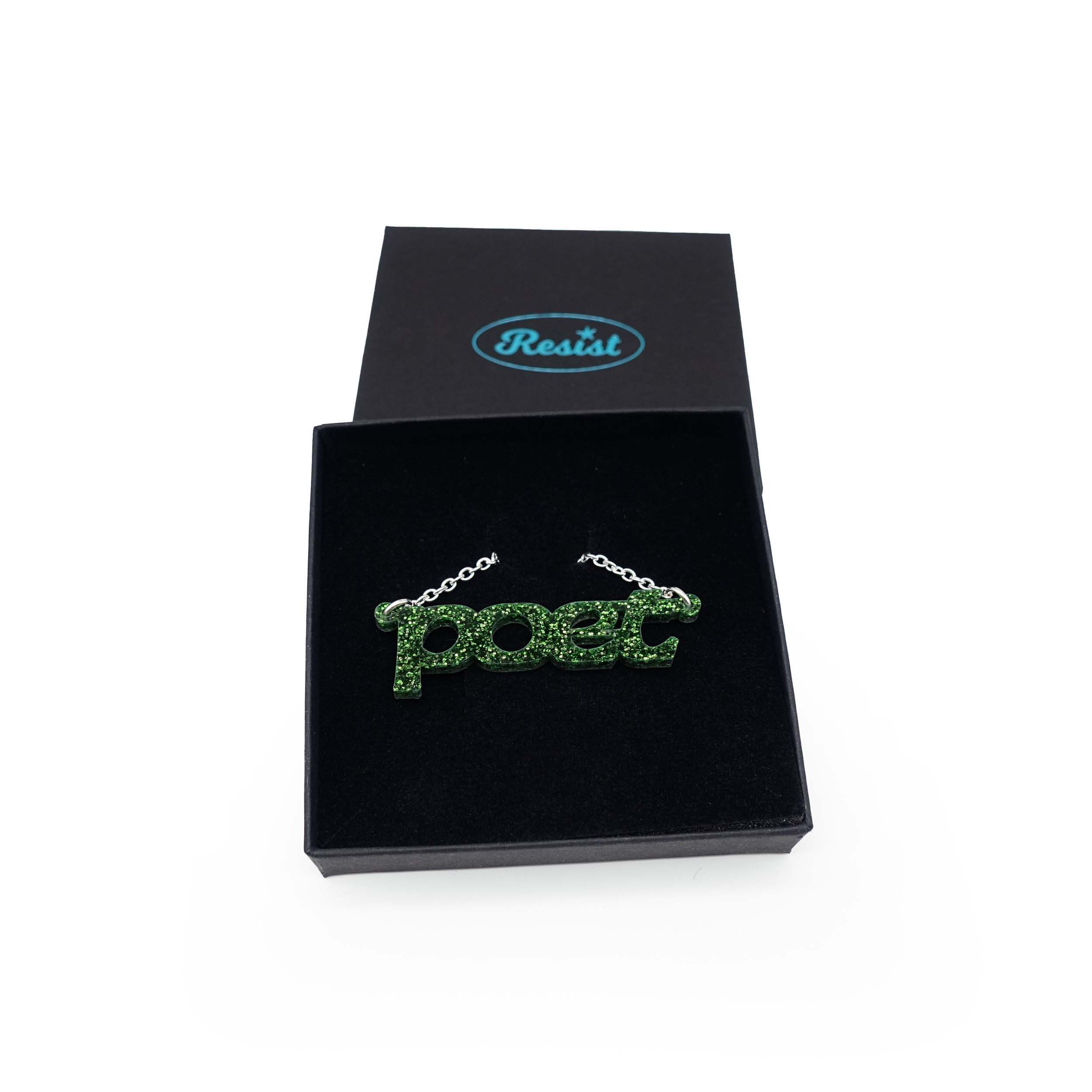 Poet necklace in moss glitter, shown in a Wear and Resist gift box. 