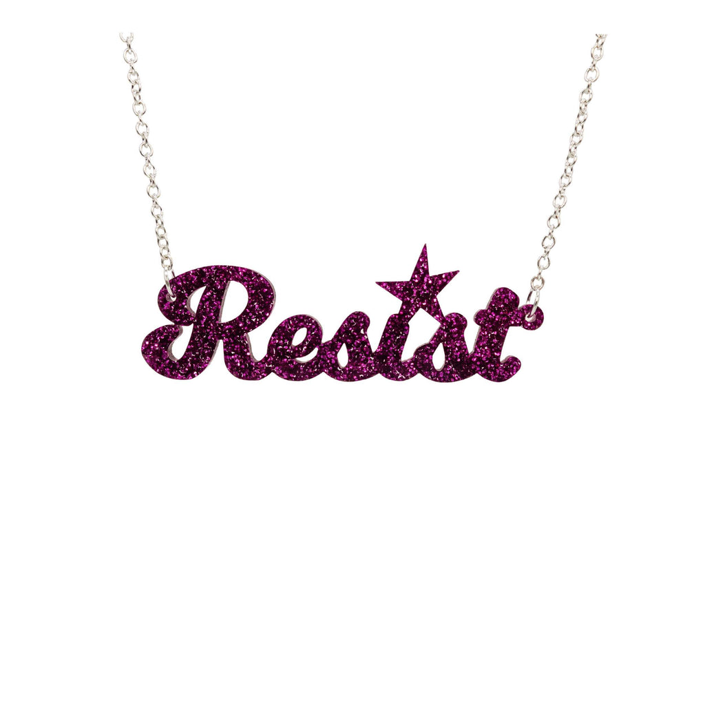 Purple glitter script Resist necklace shown hanging against a white background. 