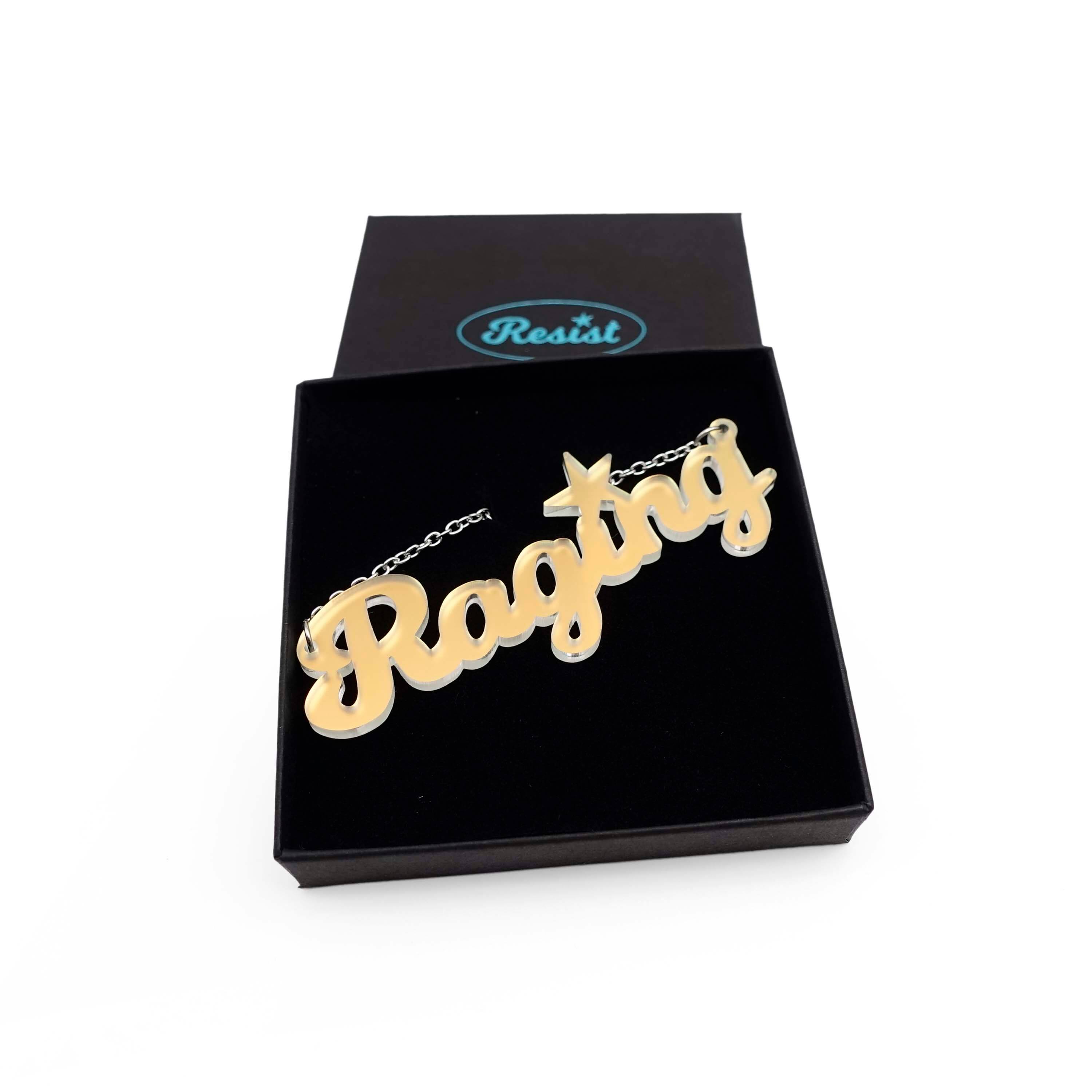 Matte iridescent Raging necklace shown in a Wear and Resist gift box.
