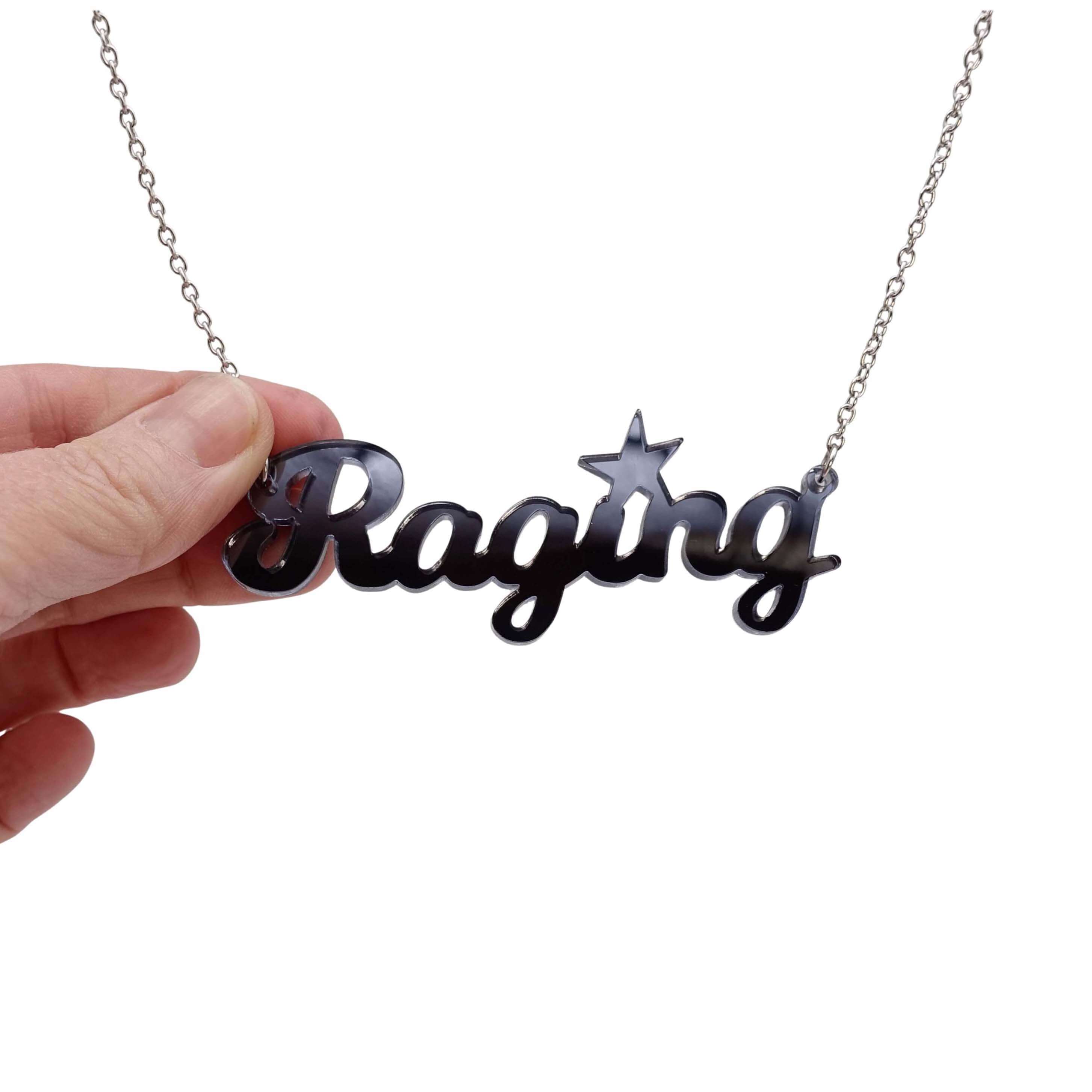 Slate mirror 
Raging necklace on a stainless steel chain shown hanging against a white backround. 