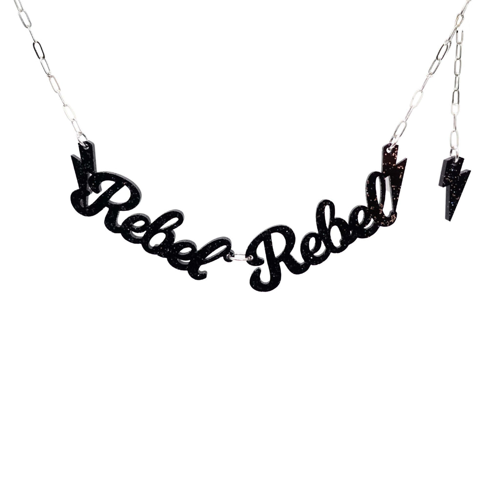 Rebel Rebel necklace in black glitter shown hanging against a white backround. 